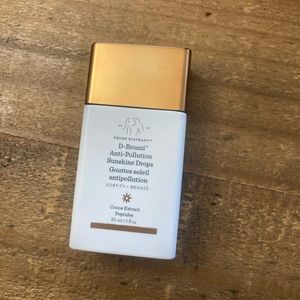 Drunk Elephant D-Bronzi Anti-Pollution Sunshine Drops.
